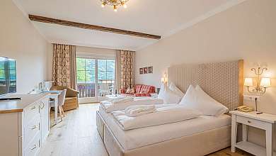Bright hotel room with double bed